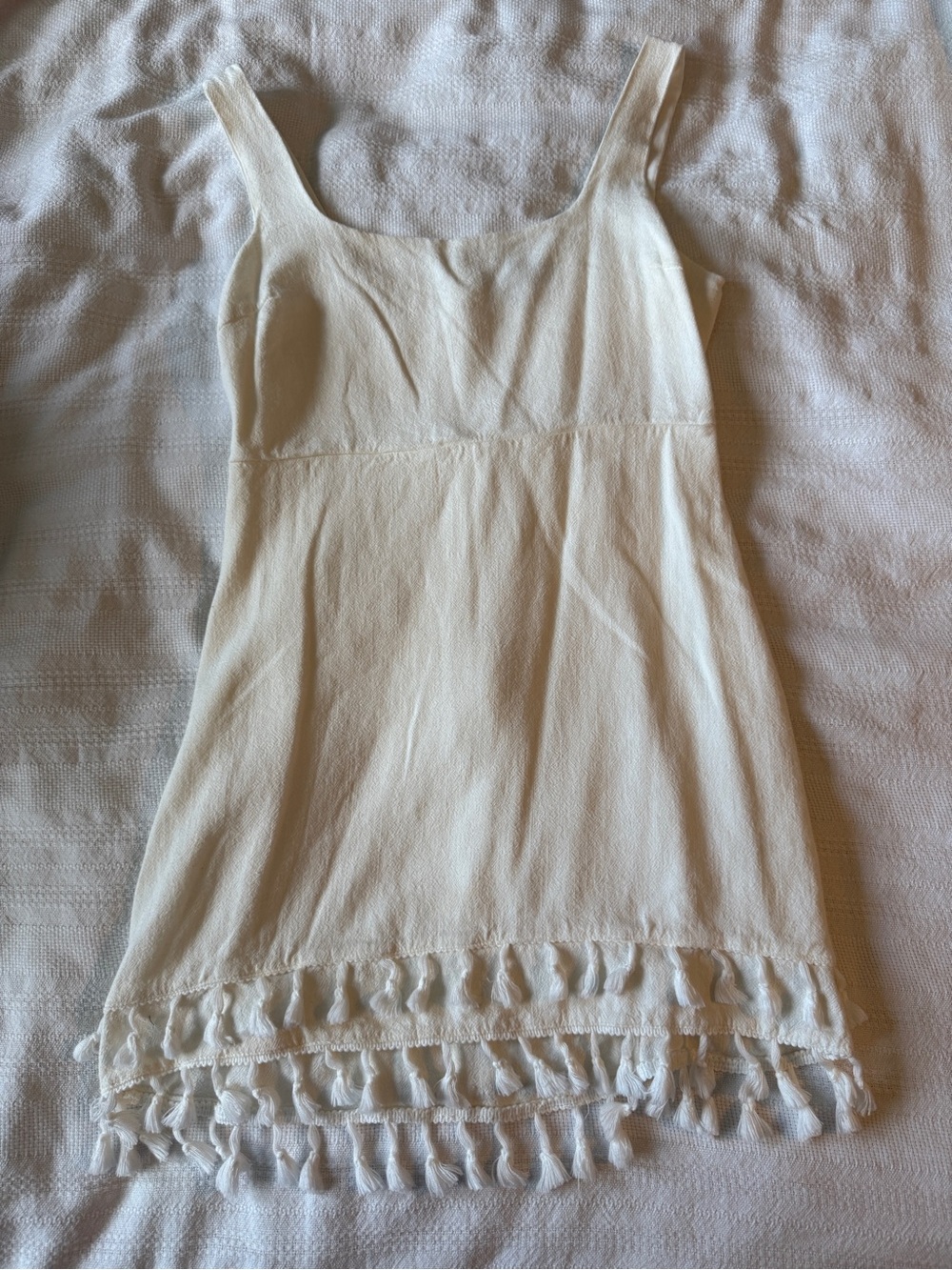 Lulu's Cream Tassel-Hem Sleeveless Dress